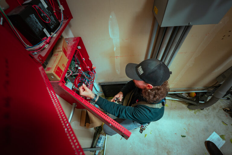 Fire protection inspection in Seattle commercial building by AAA Fire technician